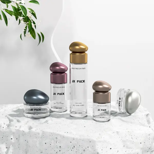 Glass skincare bottle with pebble cap